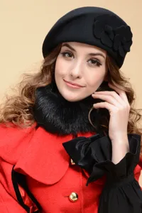 Classic black wool beret for women, featuring elegant floral decor and cozy winter style.