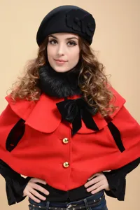 Fashionable winter wool beret and red cape set for women, elegant style with bow detail.