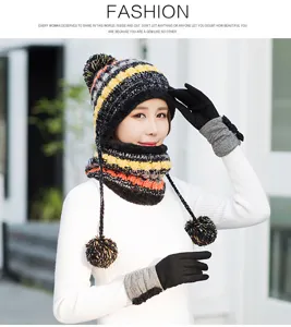 Detailed close-up view of winter warm knit hat, scarf and gloves set with soft plush lining.