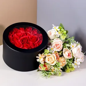 Black round window gift box with red roses and floral bouquet for gifts and DIY flower arrangements.
