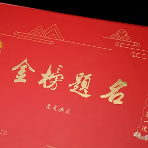 Gold title gift box packaging for graduation celebration, premium red paper gift box detail