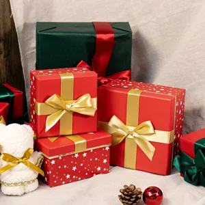 Christmas gift box detail view, red and green decorative holiday packaging with bows.