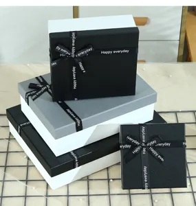 Elegant black and grey gift boxes with ribbon bows, perfect for Valentine's Day and special presents.
