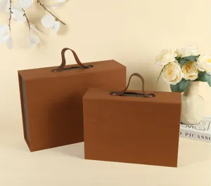 Brown wooden texture gift boxes with handles, elegant packaging for wedding and events.