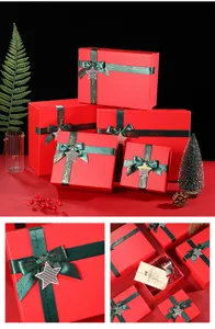 Christmas red gift boxes set with green ribbons and star charms, perfect holiday packaging.