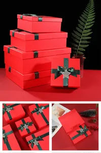 Red Christmas gift box detail, featuring green ribbon and star charm for festive packaging.