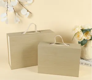 Wooden flip-top gift box detail view, elegant packaging with fabric handle for wedding and parties.