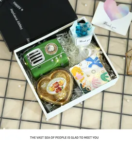 Valentine gift box set with retro speaker chocolate flower fairy lights for romantic holiday.