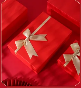 Elegant red gift box set with satin ribbon, perfect for birthdays and holidays packaging.
