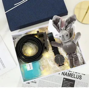 Luxury gift box set with watch belt perfume and cute plush bunny for holiday gifting.