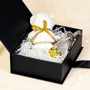 Black gift box set featuring white towel bear and glass bottle for valentine day gift.