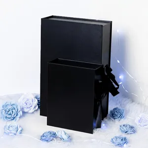 Black magnetic gift boxes with ribbon, luxury book-style packaging for birthday and party gifts.