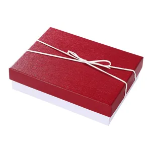 Red gift box with white ribbon bow, rigid cardboard present packaging box for jewelry.
