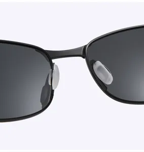 Detailed close-up view of metal sunglasses nose pads and bridge, classic retro design.
