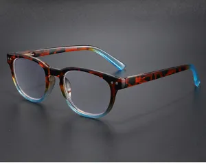Close-up detail of retro tortoiseshell reading glasses frame with blue gradient temples and rivets.