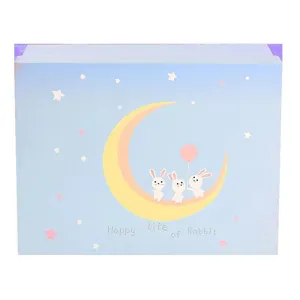 Blue lid and base gift box with cute moon and rabbit illustration, perfect for children.