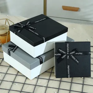 Elegant gift boxes with black ribbon bows, perfect for Valentine's day and special gifts.