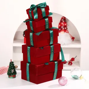 Burgundy velvet Christmas gift box set with green ribbon bow, luxury holiday packaging.