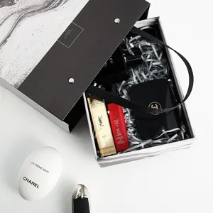 Luxury black and white marble gift box set with premium cosmetic products inside studio shot
