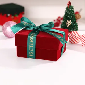 Burgundy velvet gift box with green ribbon bow detail, perfect for Christmas holiday packaging.