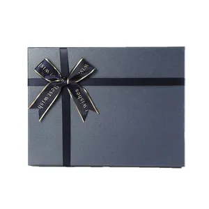 High-end blue gift box with ribbon bow, elegant packaging for birthdays, holidays and weddings.