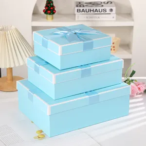 Set of 3 light blue gift boxes with white edges and ribbons for cosmetics, jewelry, and parties.