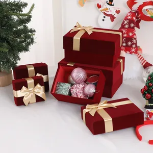 Red velvet gift box with gold ribbon bow for wedding, birthday, and holiday packaging display.