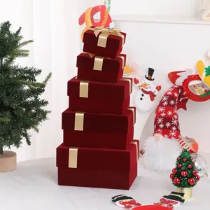 Red velvet gift boxes with gold ribbon, elegant packaging for holiday party wedding and gifts.