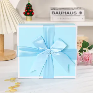 Blue gift box with elegant ribbon bow, perfect for cosmetics, scarves and birthday gifts.