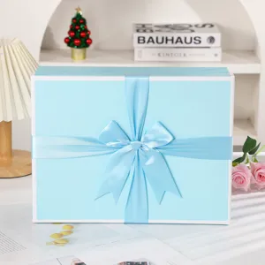 Light blue gift box with satin bow, empty packaging for gifts, cosmetics and scarfs