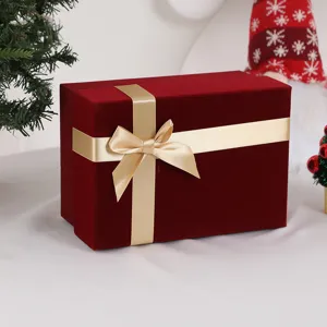 Red velvet gift box with gold ribbon bow for Mother's Day, wedding, and cosmetics.