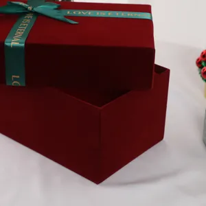 Burgundy velvet gift box with green ribbon, elegant packaging for wedding and party.
