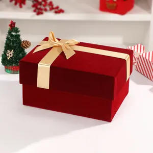 Christmas velvet gift box with gold bow for holiday gifts and perfume packaging