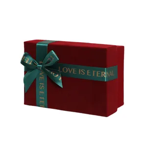 Red velvet gift box with green ribbon and bow, perfect for weddings, cosmetics and packaging.