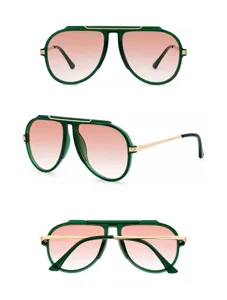 Detail view of stylish aviator sunglasses with green thick frames and gradient pink lenses.