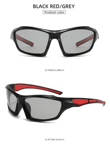 Vue détaillée des lunettes de soleil de sport avec monture noire et rouge et verres gris.