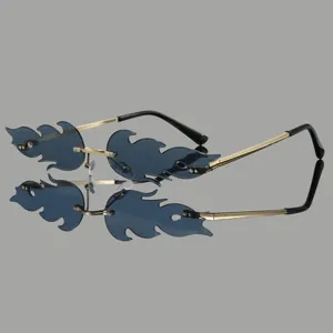 Trendy unique flame shape rimless sunglasses with dark lenses and metal temples.