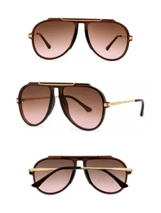 Detailed view of brown gradient aviator sunglasses with gold metal bridge and sleek temples.
