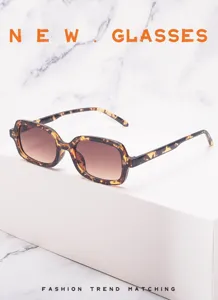 Retro tortoiseshell rectangular sunglasses detail shot showing gradient lenses and stylish frame.