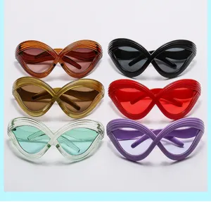 Futuristic Y2K cat-eye sunglasses detail showcasing unique bold lines and vibrant colors.