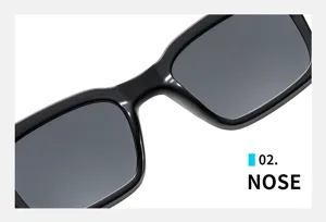 Close-up detail view of fashionable square black sunglasses bridge and frame structure.