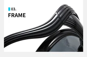 Detailed close-up of futuristic avant-garde sunglasses frame with sleek glossy black lines.