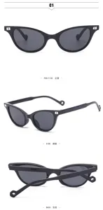 Detail view of black cat-eye sunglasses featuring metal B logo on temples and UV protection.
