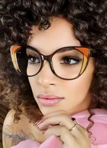 Close-up detail of stylish butterfly blue light blocking glasses with chic color-block frame.