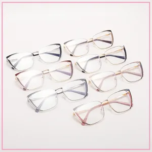Detail view of multiple color variations of blue light blocking metal cat eye glasses frames.