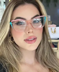 Close-up detail of trendy pink butterfly anti-blue light eyeglasses on model, stylish frame.