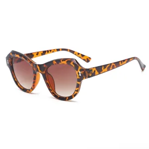 Stylish women's irregular cat-eye sunglasses with gradient lenses and chic rivet details.