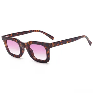 Retro tortoiseshell cat-eye sunglasses with gradient pink lenses for women fashion trend.
