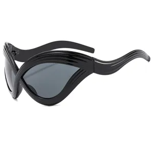 Futuristic Y2K cat-eye sunglasses with exaggerated wavy curves, trendy runway black eyewear.