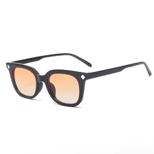 Retro square sunglasses with gradient orange lenses and chic diamond rivets. Stylish eyewear.